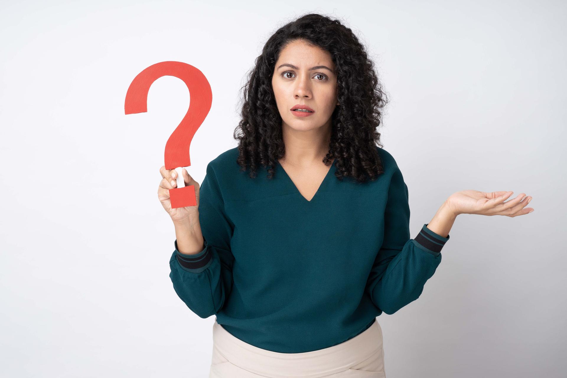 a women holding a question mark