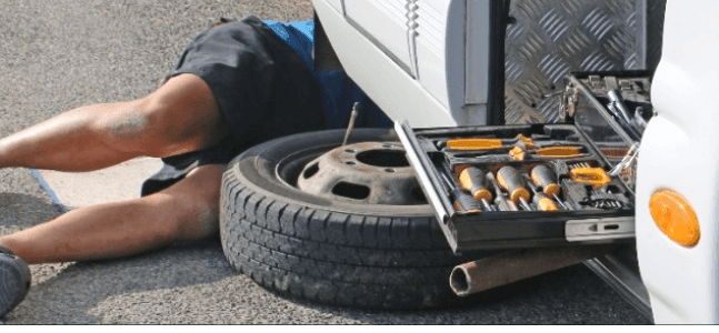 fixing a tire on a camper