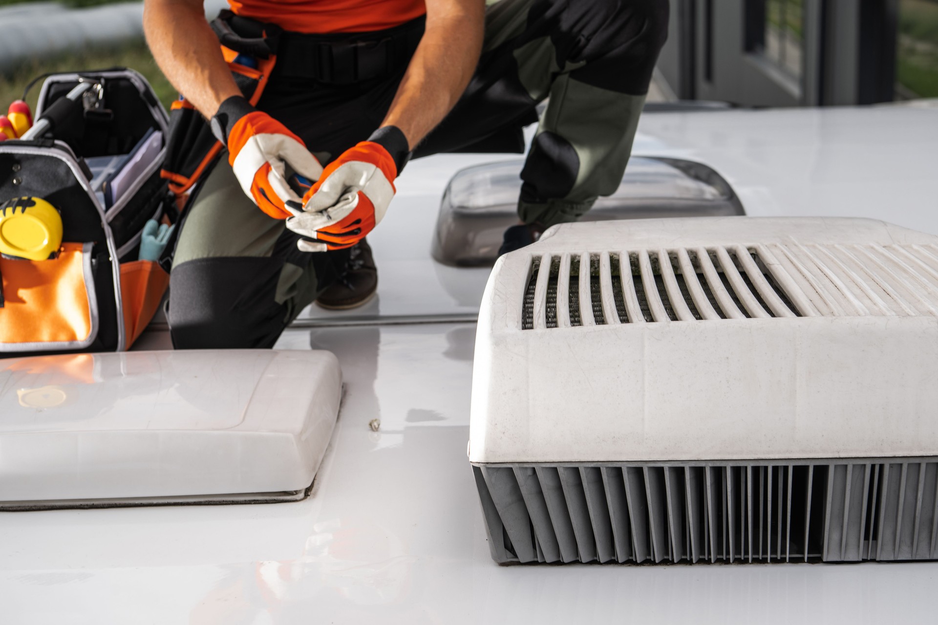 Technician Working on RV Air Conditioner